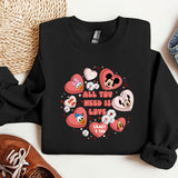 a black sweatshirt with hearts and mickey mouses on it