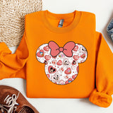 an orange shirt with a pink bow on it