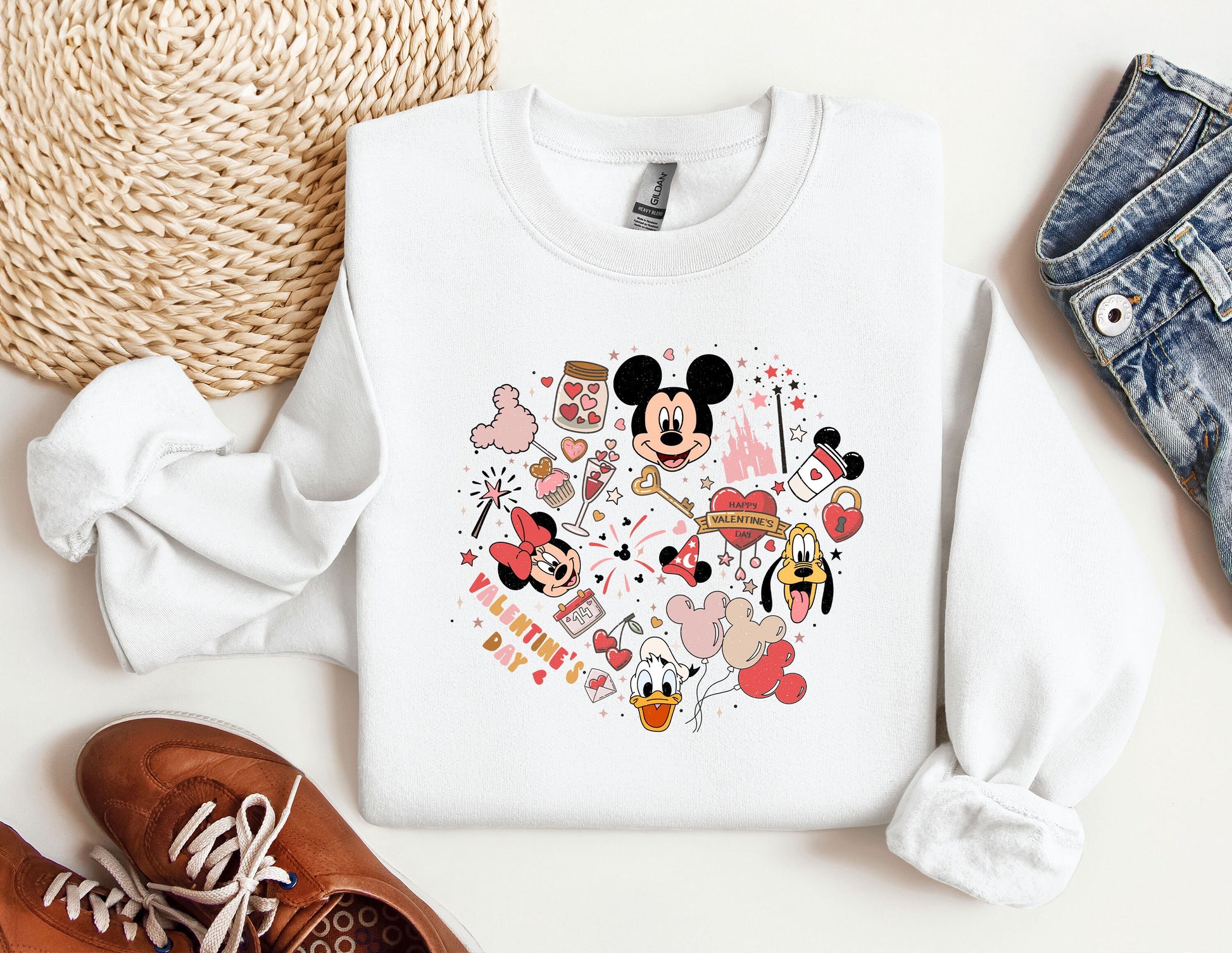 a mickey mouse shirt and some shoes on a table