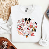 a mickey mouse shirt and some shoes on a table