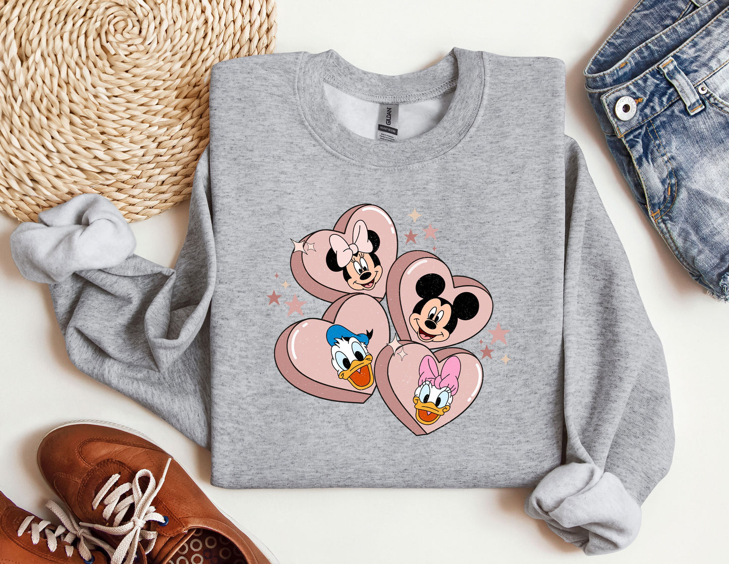 a sweater with mickey and minnie mouses on it