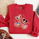 a red sweatshirt with mickey mouse hearts on it