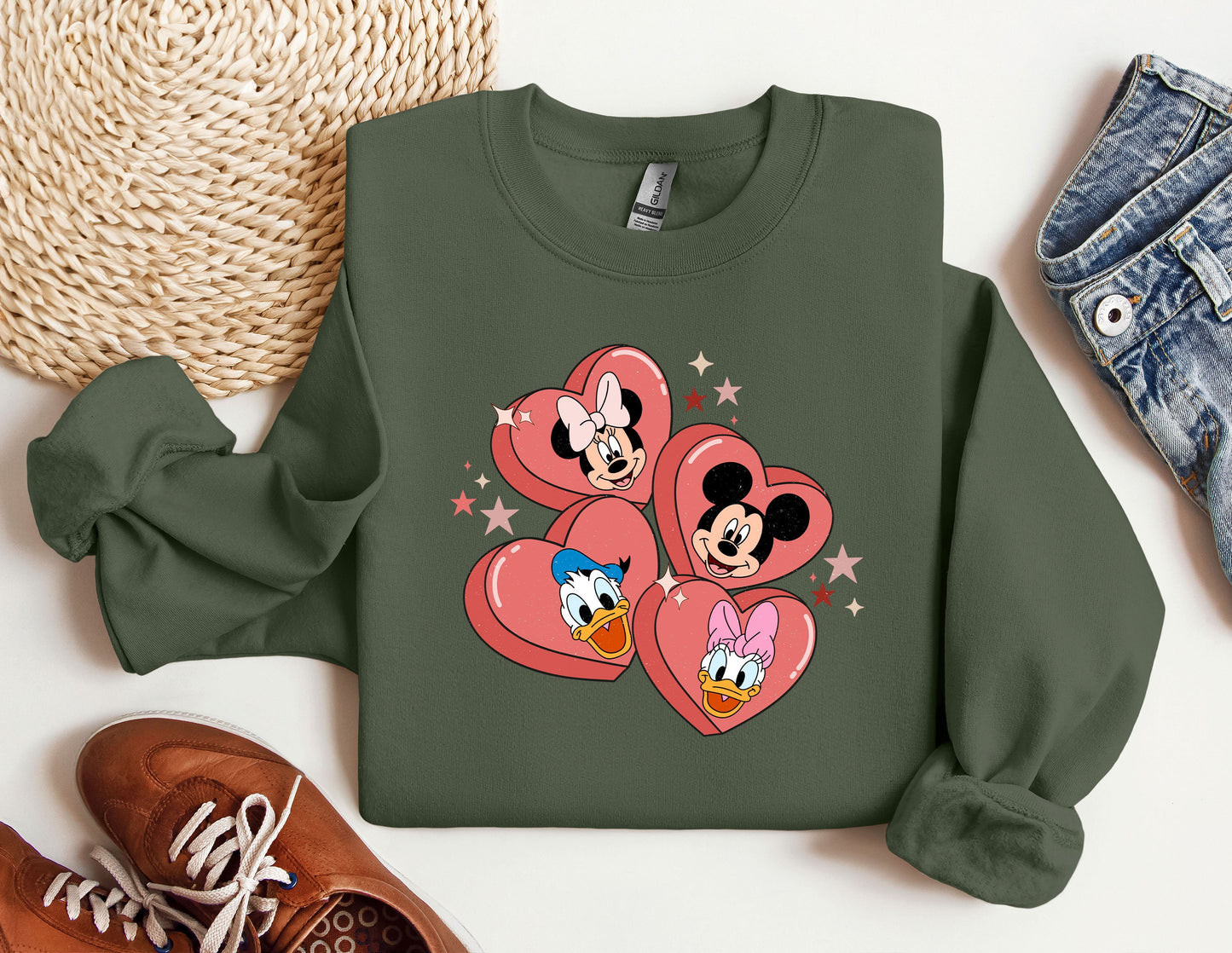 a green sweatshirt with mickey and minnie hearts on it