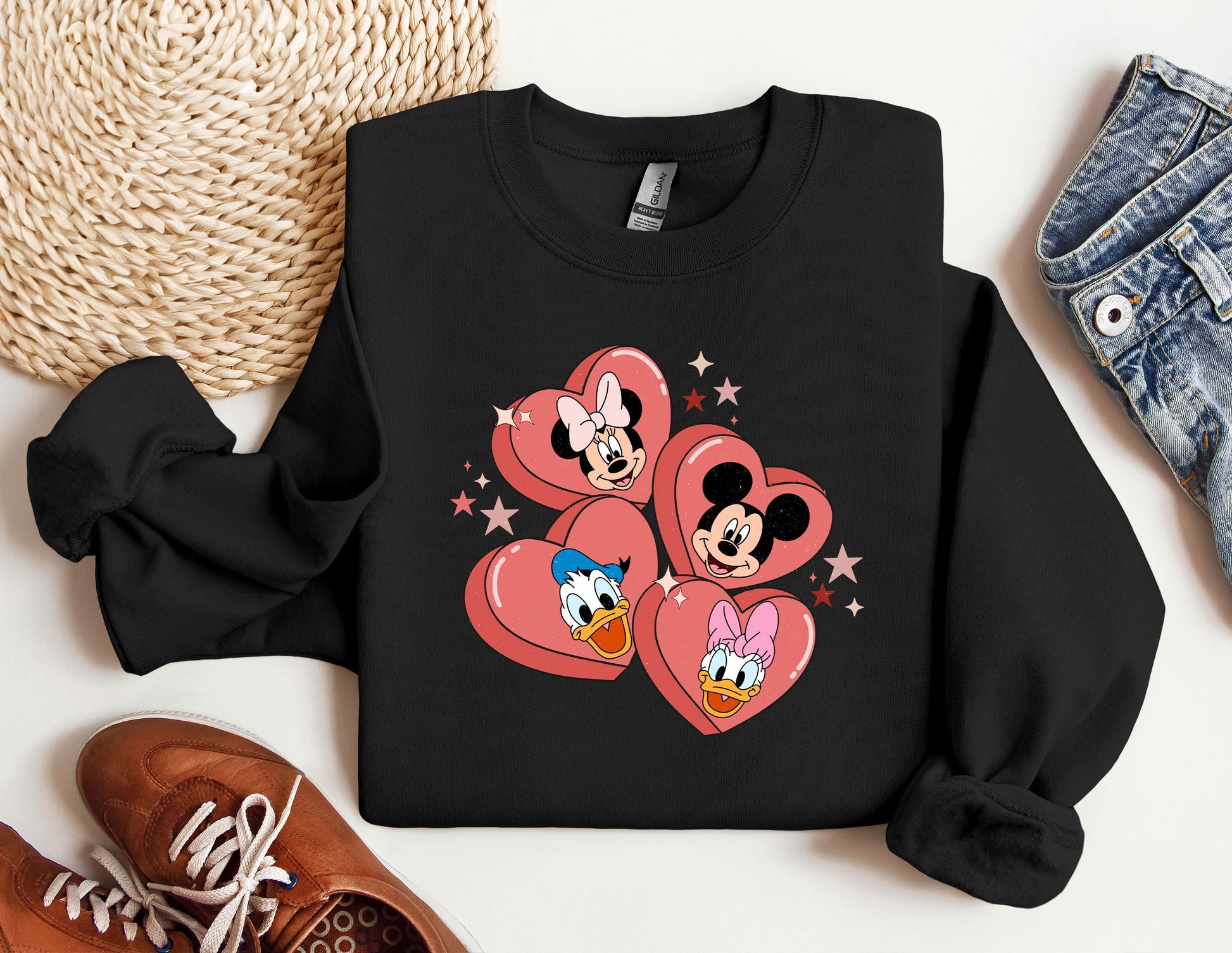 a pair of sneakers and a mickey mouse sweatshirt