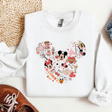 a pair of shoes and a mickey mouse sweatshirt