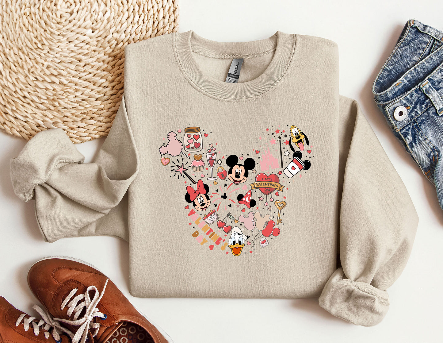 a sweater with a mickey mouse design on it