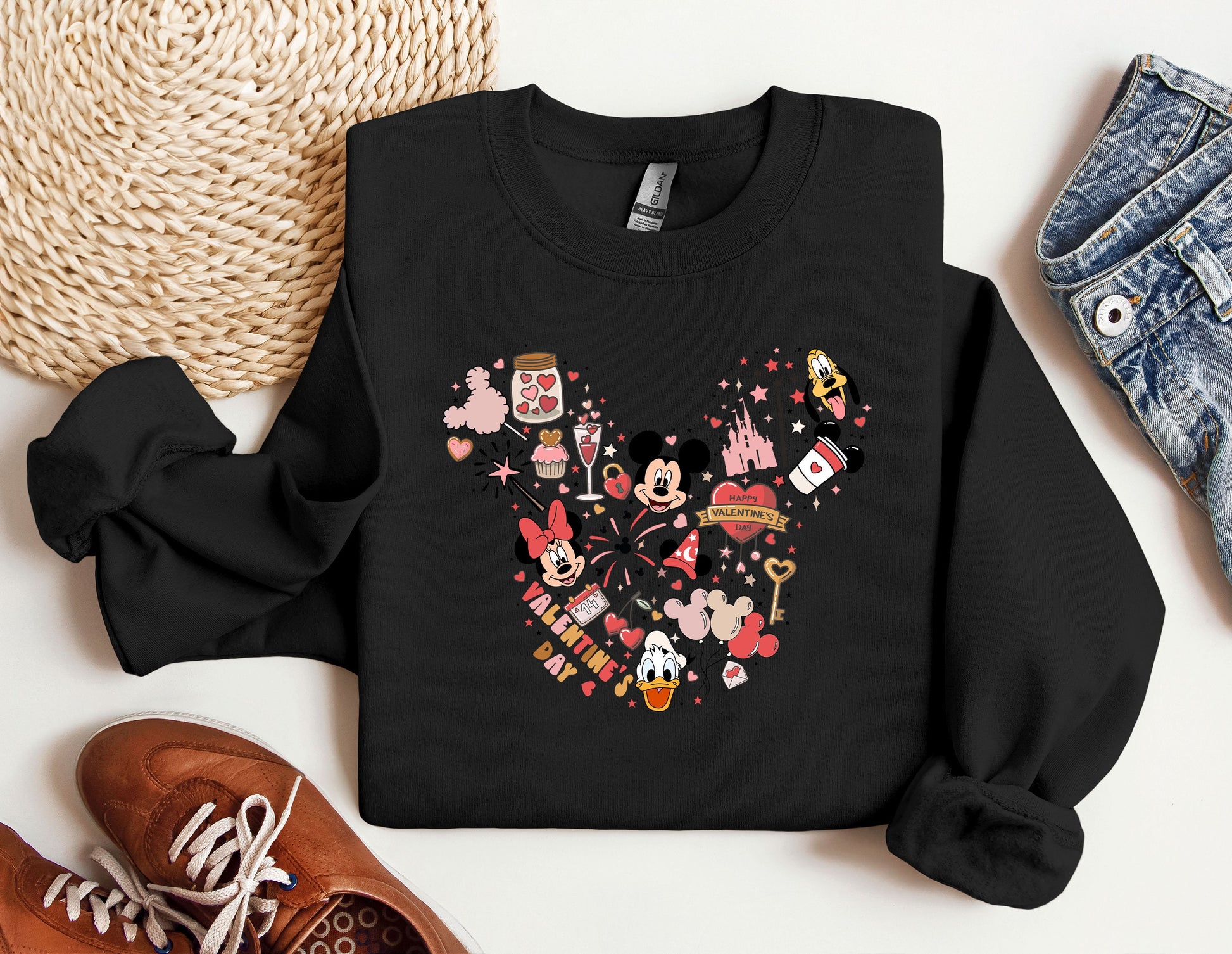 a black sweatshirt with a mickey mouse design on it