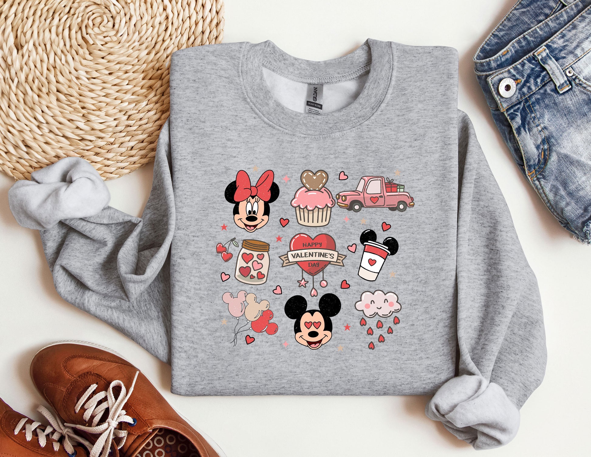 a sweater with mickey mouse and other disney characters on it