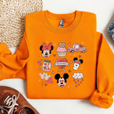 a pair of sneakers and a sweatshirt with mickey mouse on it