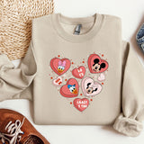 a pair of shoes and a sweater with mickey mouse on it