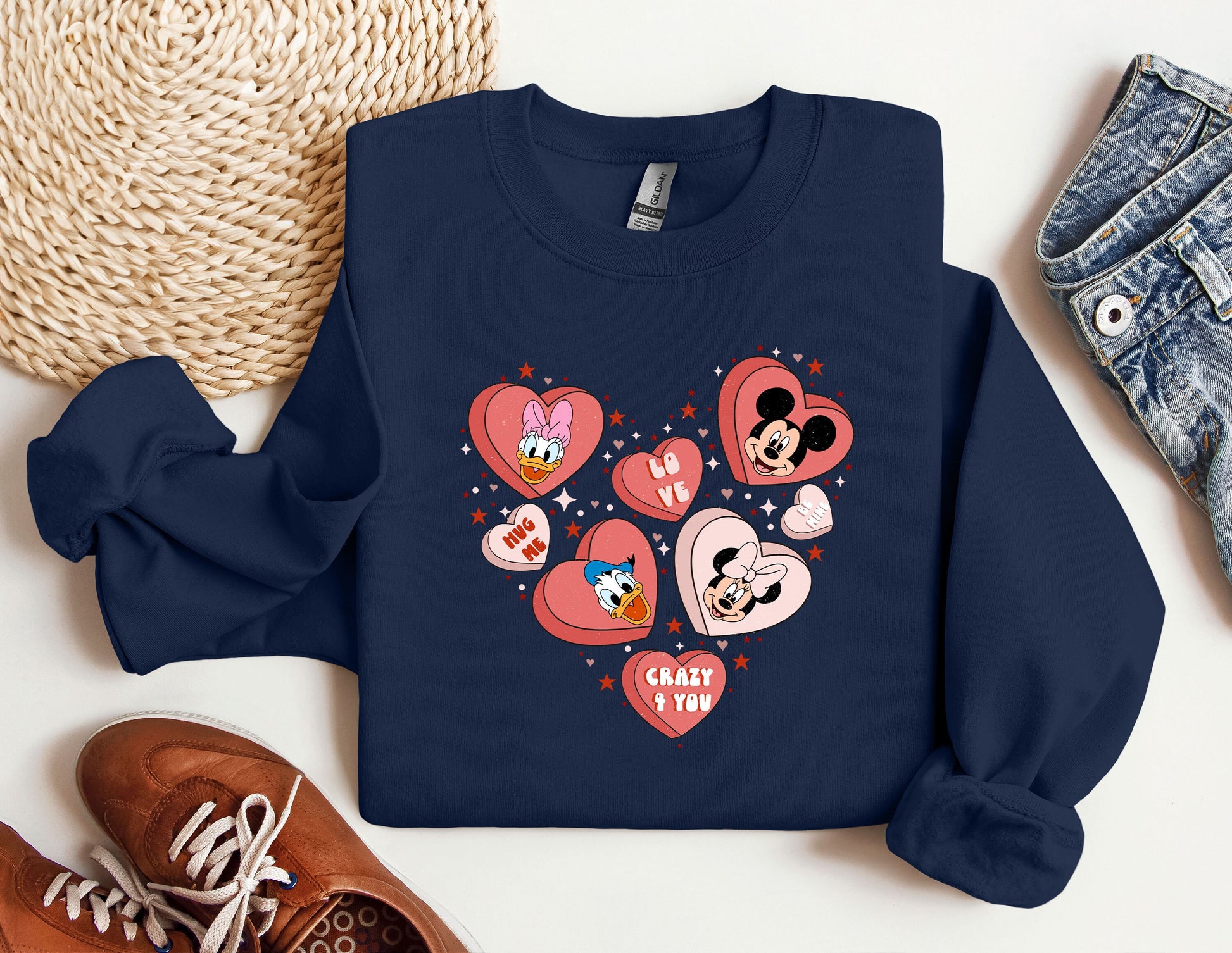 a blue sweatshirt with hearts and mickey mouses on it