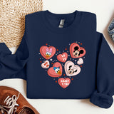 a blue sweatshirt with hearts and mickey mouses on it