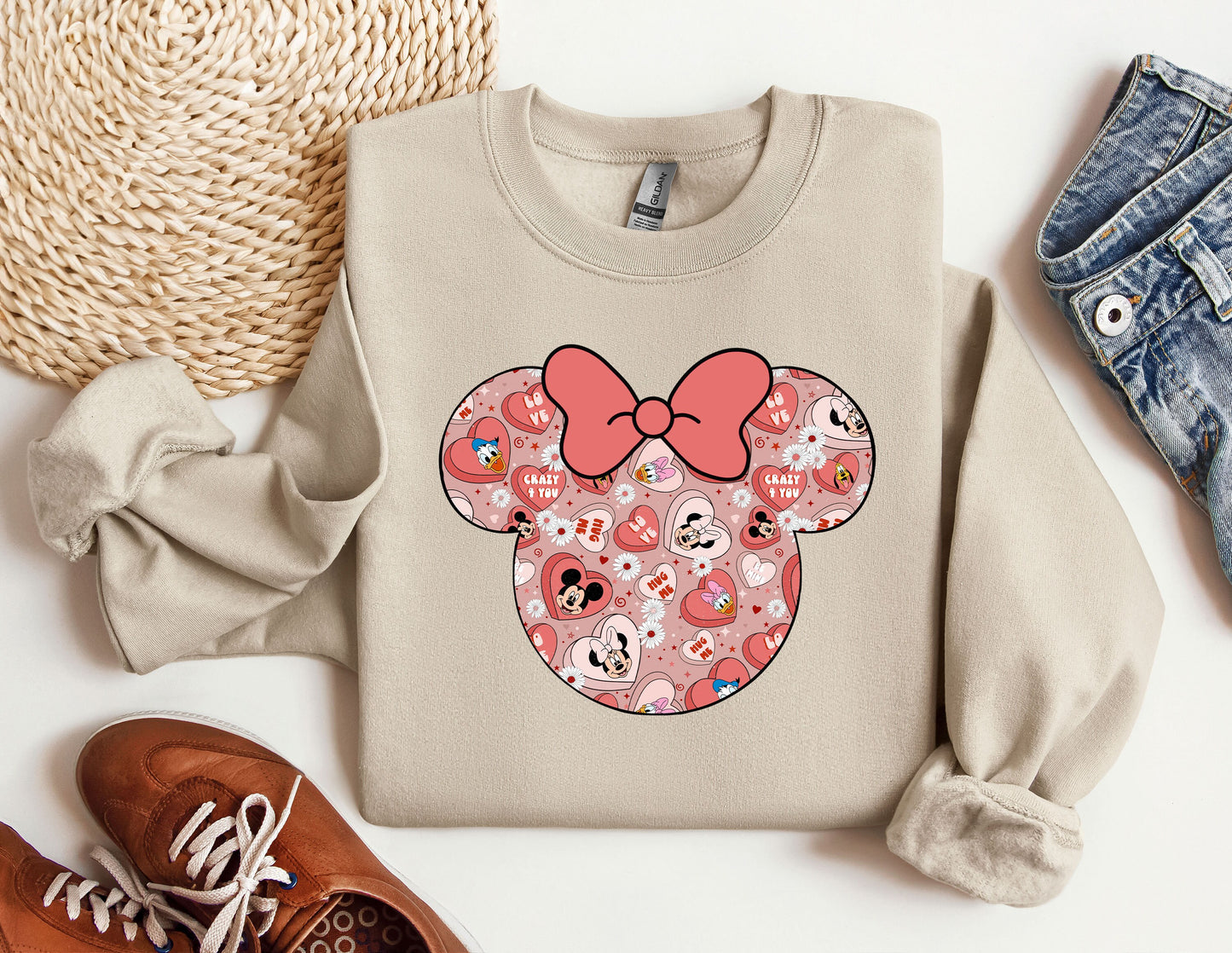 a sweater with a minnie mouse design on it