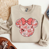 a sweater with a minnie mouse design on it