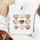 a white shirt with mickey mouse hearts on it