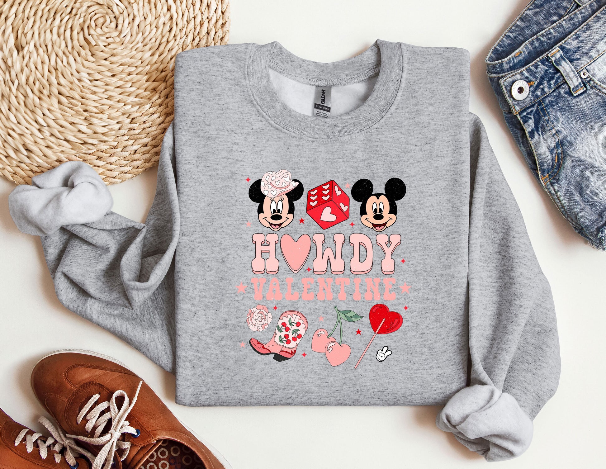 a sweatshirt with mickey and minnie mouses on it