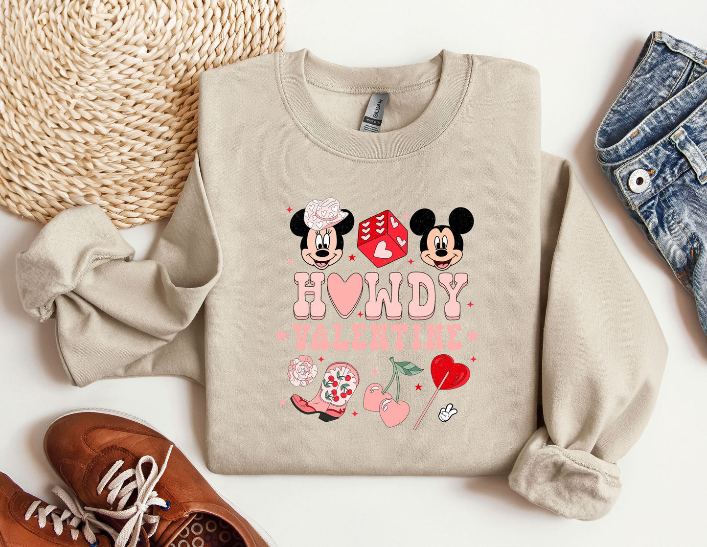 a pair of shoes and a sweatshirt with mickey and minnie mouse on it