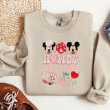 a pair of shoes and a sweatshirt with mickey and minnie mouse on it