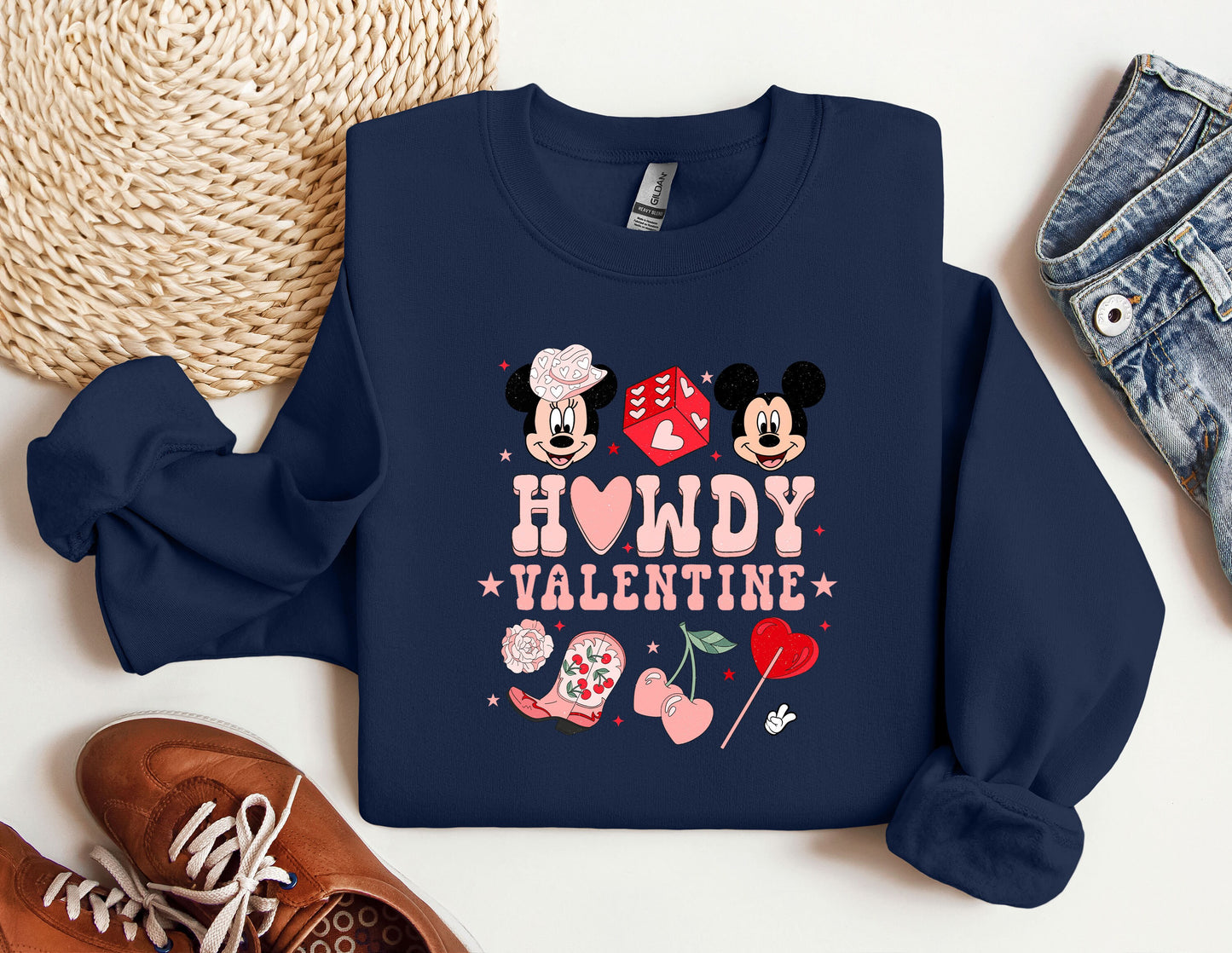 a blue sweatshirt with mickey and minnie mouses on it