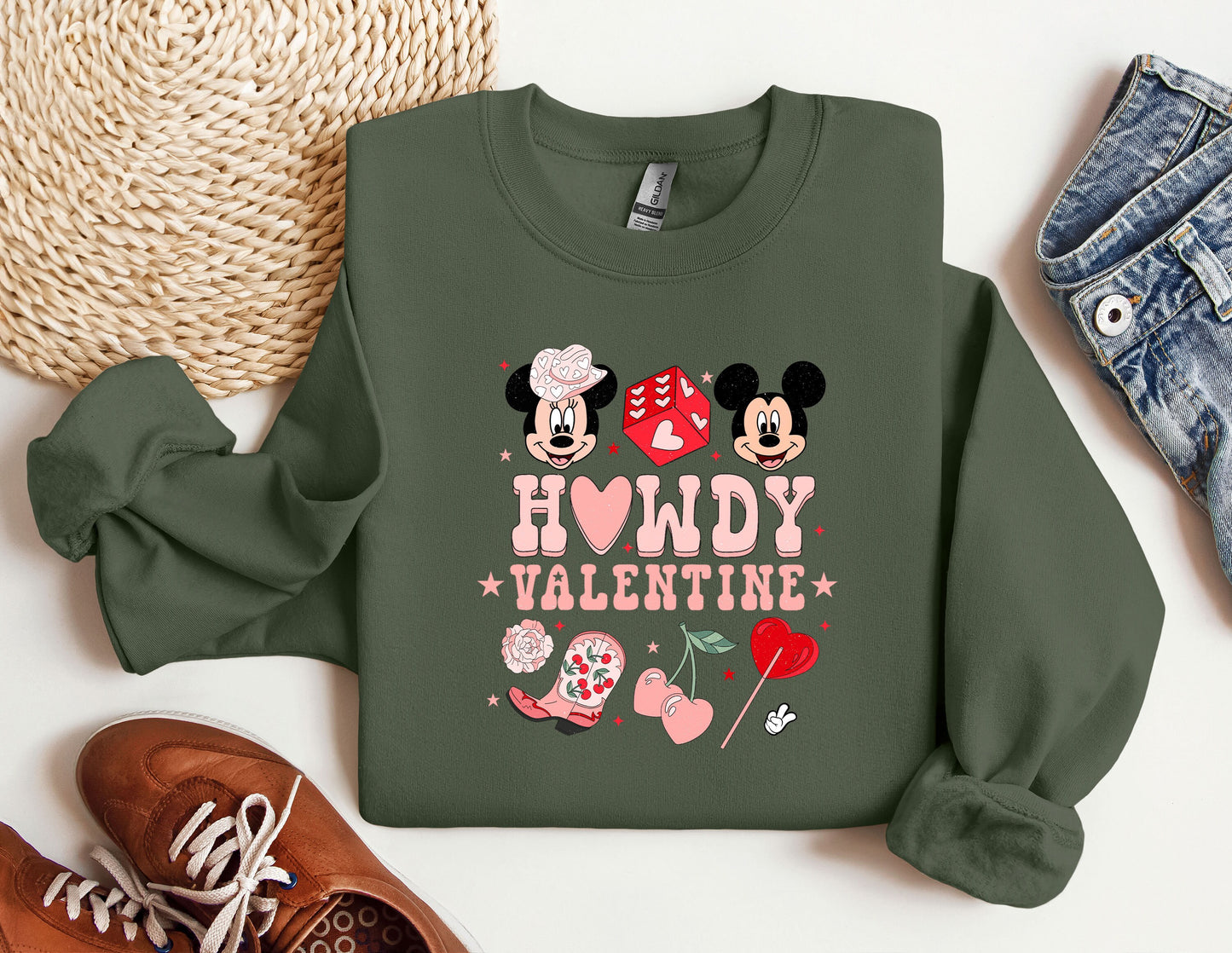 a green sweatshirt with minnie and mickey mouses on it