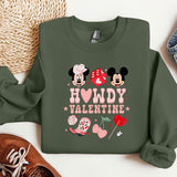 a green sweatshirt with minnie and mickey mouses on it