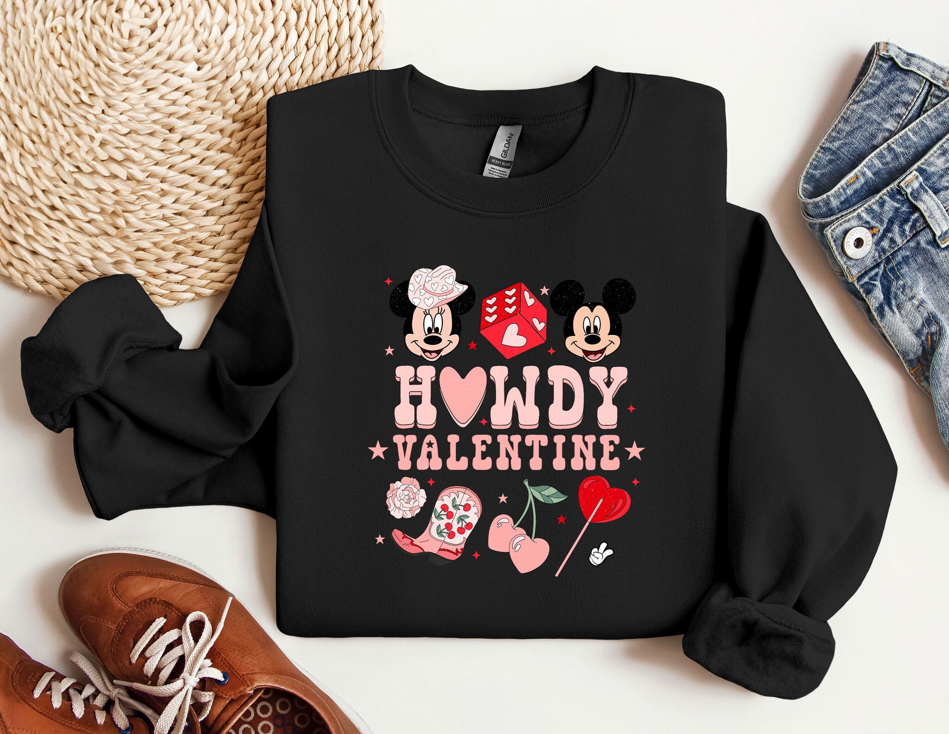 a black sweatshirt with minnie mouse and mickey mouse on it