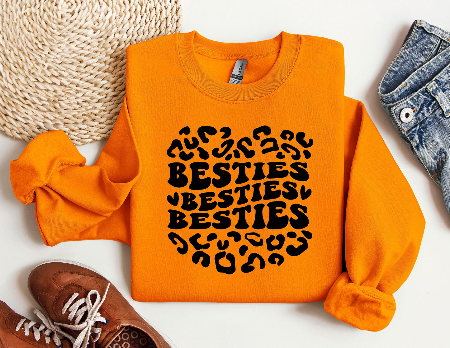 an orange sweatshirt with the words besties besties on it