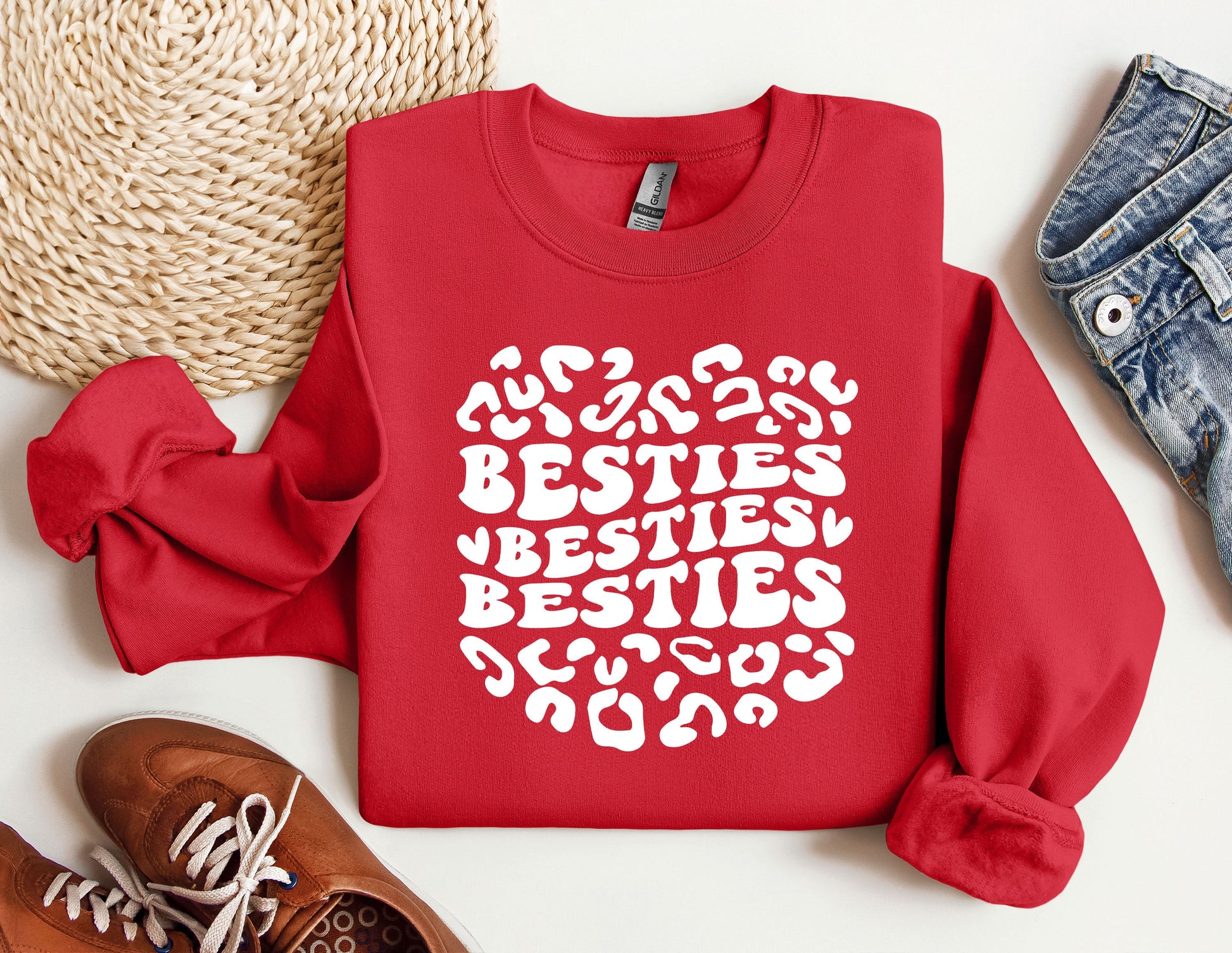 a red sweatshirt with the words besties written on it