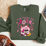 a green sweater with a mickey mouse and minnie mouse on it