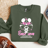 a green sweatshirt with minnie mouse on it
