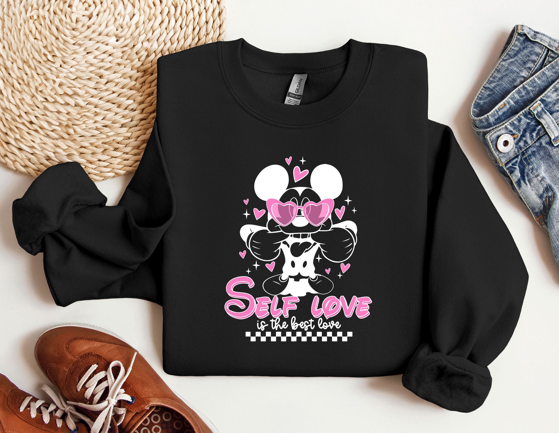 a black shirt with minnie mouse on it