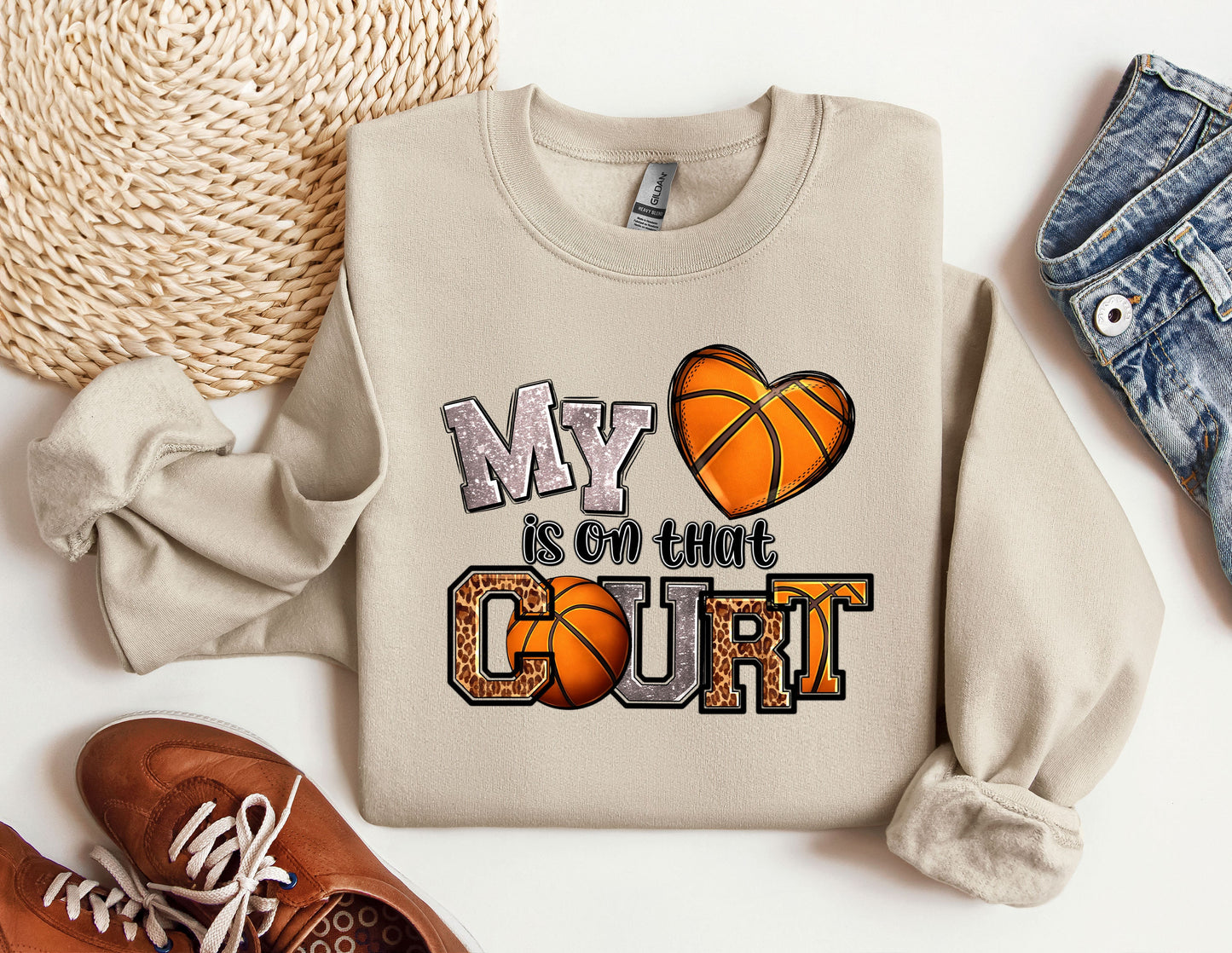 a pair of shoes and a sweatshirt with a basketball on it