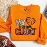 a pair of shoes and a sweatshirt with a basketball on it