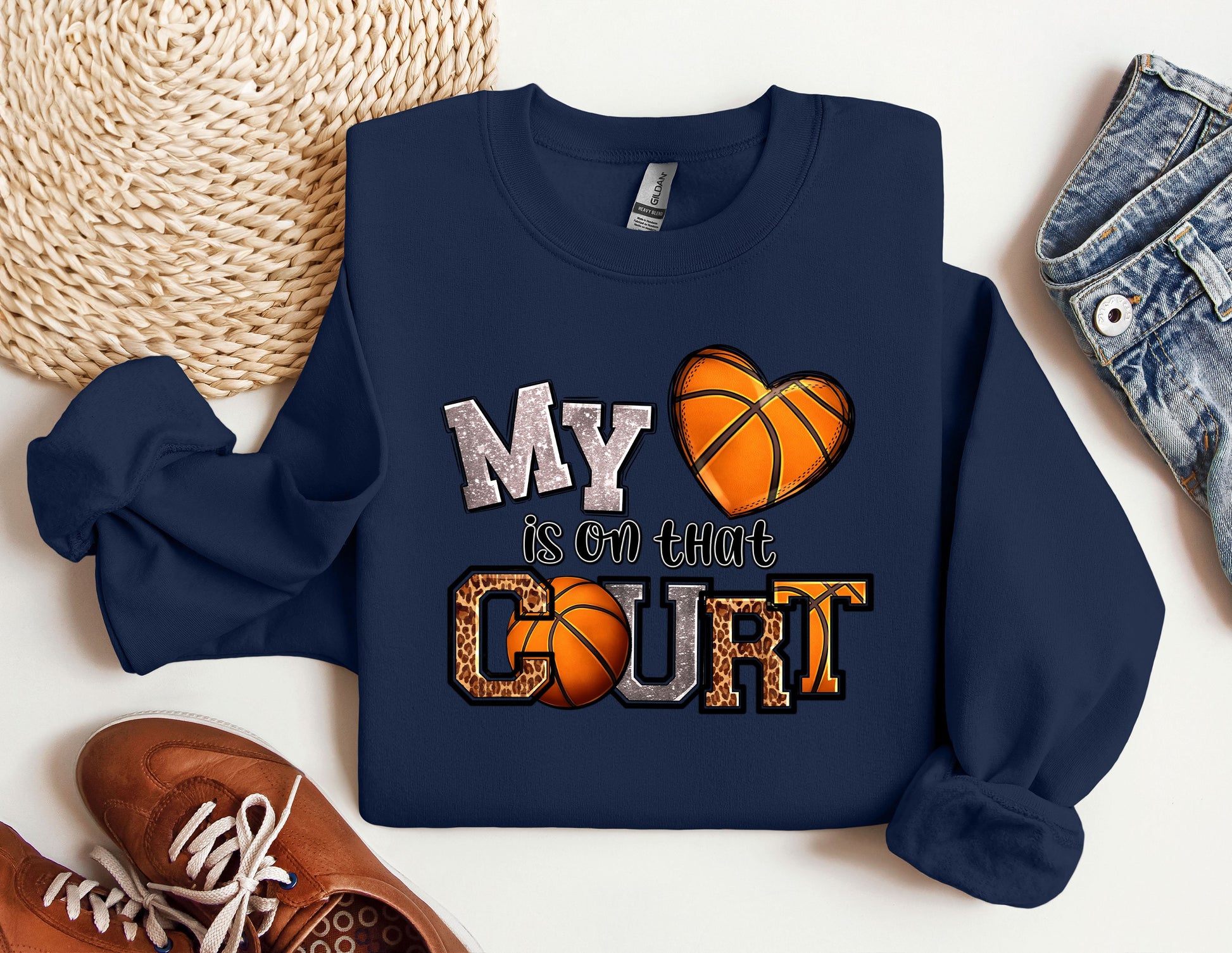 a sweatshirt that says my heart is on the court next to a pair of sneakers