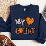 a sweatshirt that says my heart is on the court next to a pair of sneakers