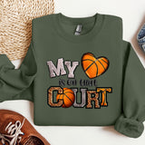 a sweatshirt with a basketball and a pair of sneakers