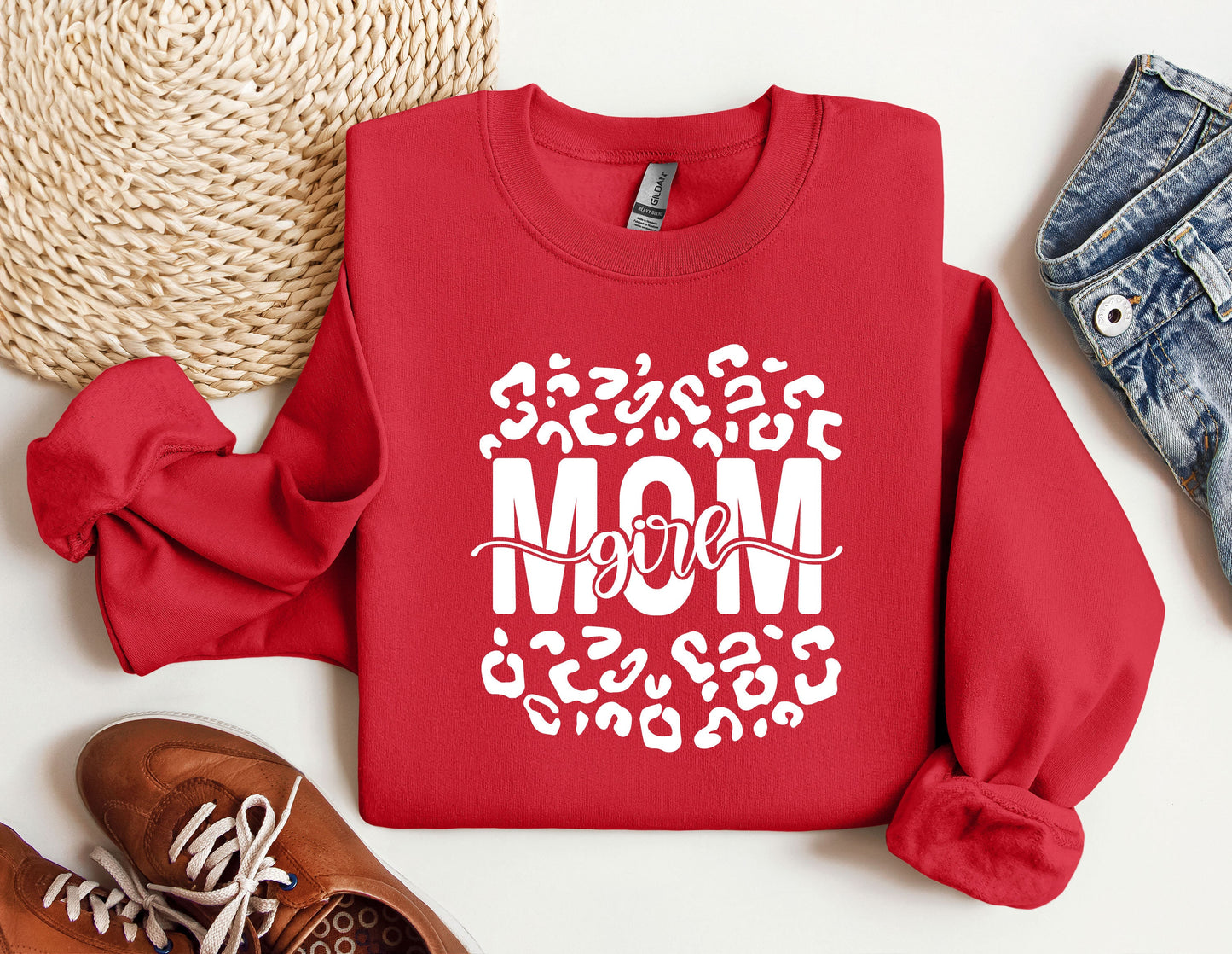 a red sweatshirt with the word mom printed on it