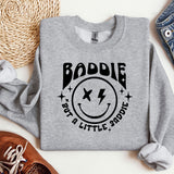 a grey sweatshirt with a smiley face on it