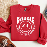a red sweatshirt with a smiley face on it