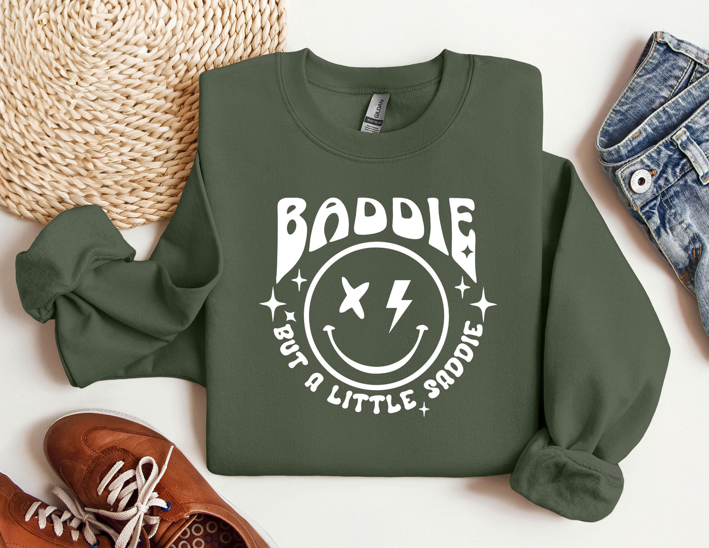 a green sweatshirt with a smiley face on it