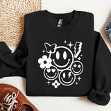 a black sweatshirt with a smiley face on it