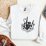 a white sweatshirt with a black and white design on it