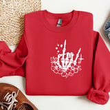 a red sweatshirt with a white flower on it