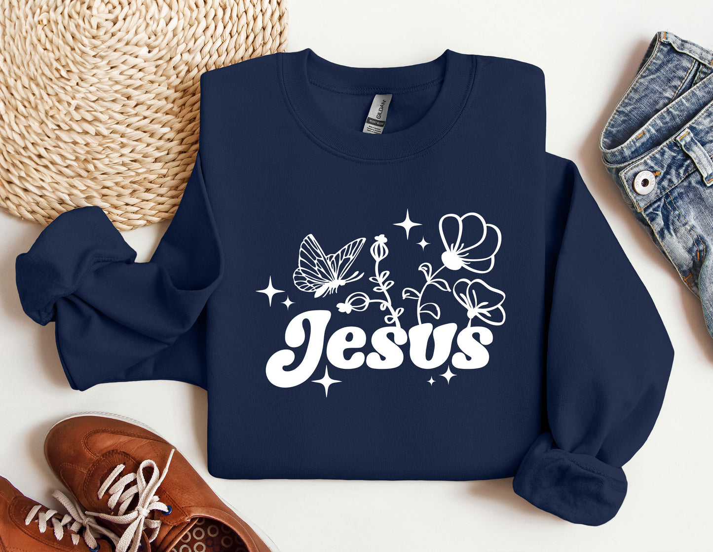 a blue sweatshirt with the word jesus printed on it