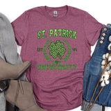 a t - shirt that says st patrick's university next to a pair of