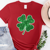 a red shirt with a green shamrock on it