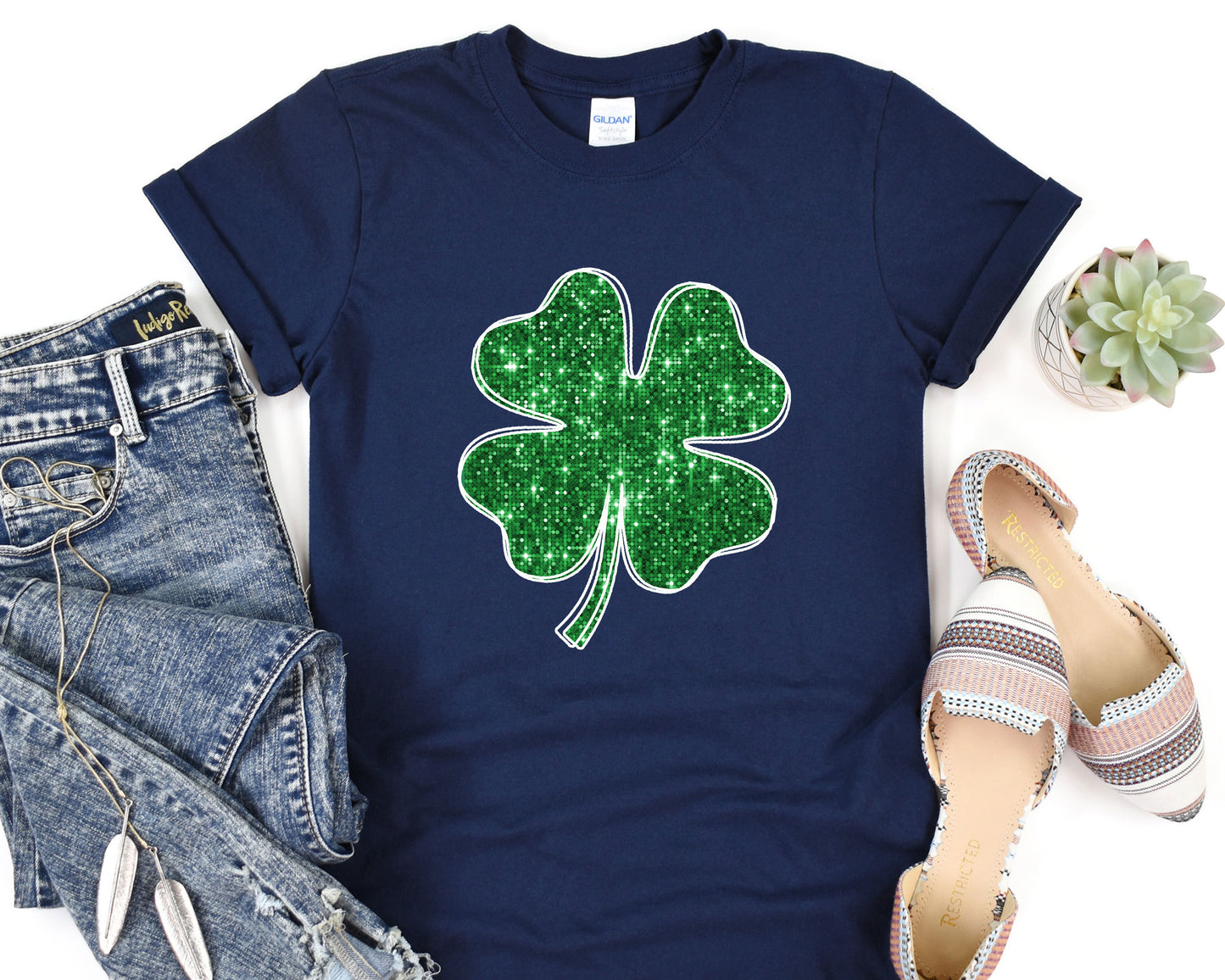 a t - shirt with a four leaf clover on it