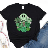 a black t - shirt with a green cartoon character on it