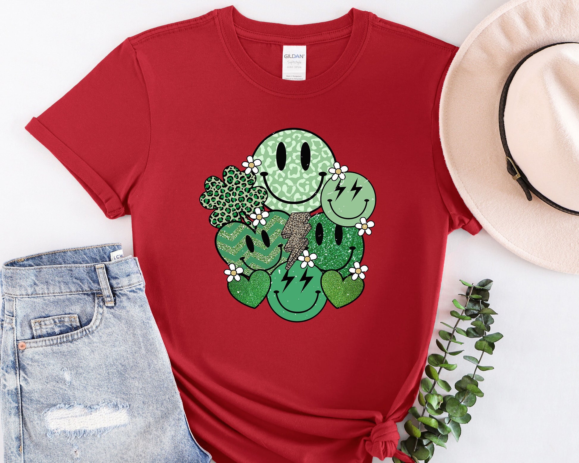 a red t - shirt with a cactus design on it