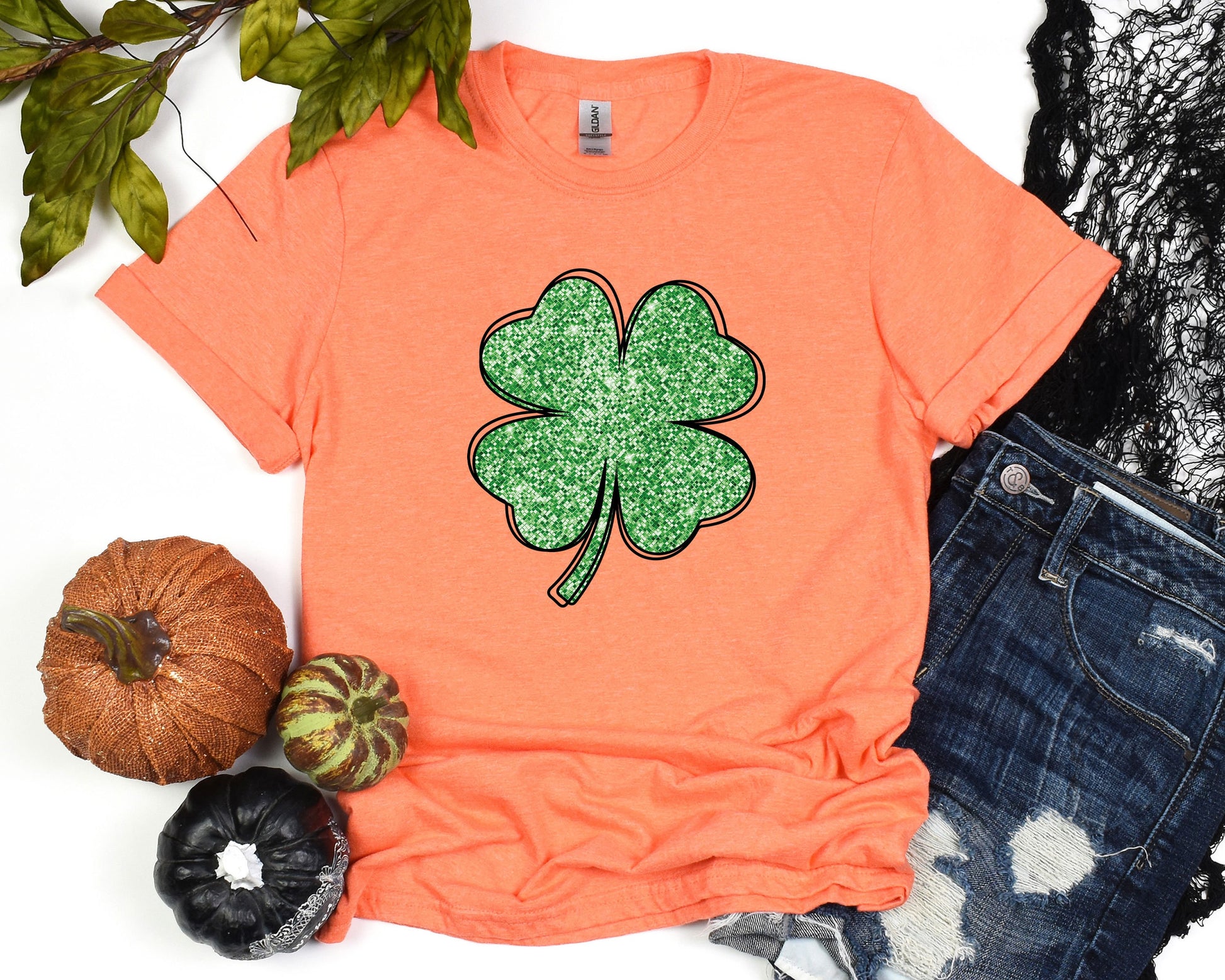 a t - shirt with a four leaf clover on it